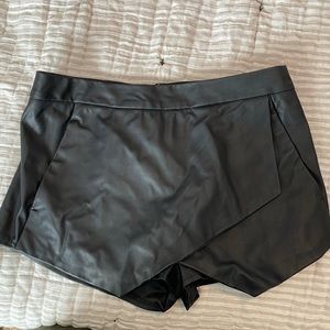 Express pleather black skort, size 4. Machine washable.
